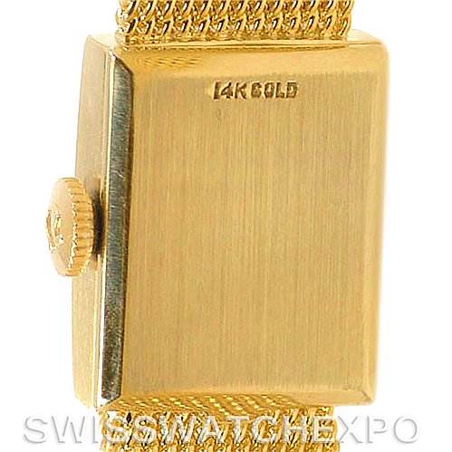 Close-up of the side and back of the Omega Women's Yellow Gold Silver Dial Women's Yellow Gold Silver Dial Vintage Ladies 14k Yellow Gold Watch Made For Tiffany, focusing on the case and crown.