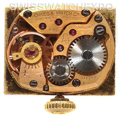 This image shows the inner mechanism of the Vintage Ladies 14k Yellow Gold Watch Made For Tiffany model by Omega Women's Yellow Gold Silver Dial Women's Yellow Gold Silver Dial from a top-down angle.