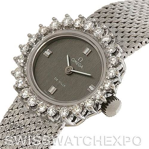 This image shows a close-up angle of the dial, bezel with diamonds, and part of the band of an Omega 8238 Women's White Gold Grey Dial 8238 Women's White Gold Grey Dial Deville Vintage Ladies 18k W Gold Diamond Watch.