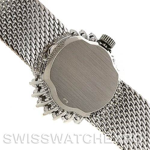 The image shows the back case and crown of the Omega 8238 Women's White Gold Grey Dial 8238 Women's White Gold Grey Dial Deville Vintage Ladies 18k White Gold Diamond Watch from a side angle.