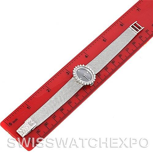 The image shows the Omega 8238 Women's White Gold Grey Dial 8238 Women's White Gold Grey Dial Deville Vintage Ladies 18k W Gold Diamond Watch from a top-down angle, displayed next to a red ruler for scale.