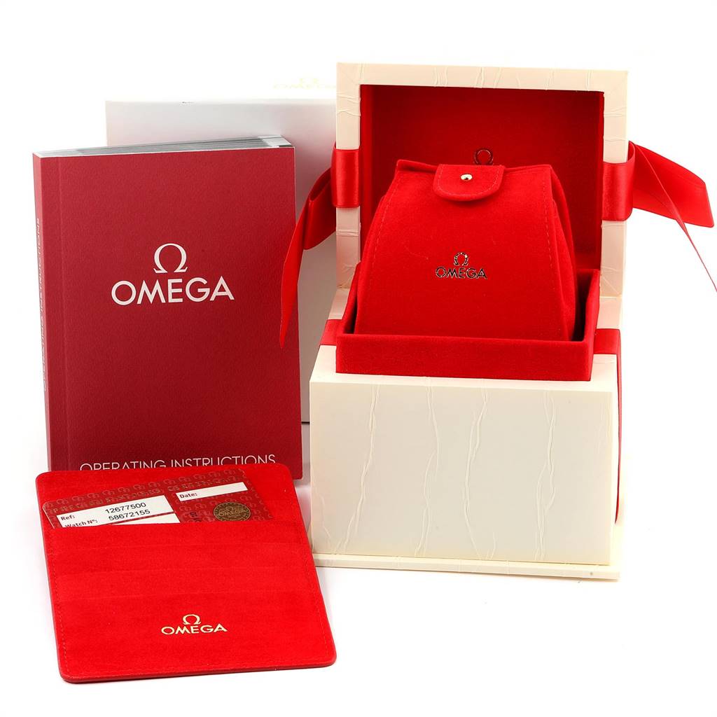 The image shows the Omega 1267.75.00 Women's Steel and Gold (two tone) Mother of Pearl Dial 1267.75.00 Women's Steel and Gold (two tone) Mother of Pearl Dial Constellation MOP Diamond Ladies Watch 1267.75.00's red box, instruction manual, and warranty card.