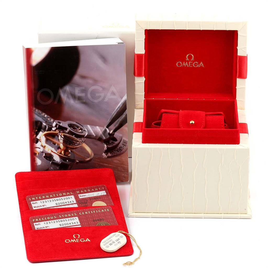 The image shows the Omega 123.12.35.60.52.001 Women's Stainless Steel Mother of Pearl Dial 123.12.35.60.52.001 Women's Stainless Steel Mother of Pearl Dial Constellation Diamond Ladies Watch 123.12.35.60.52.001 with its box, warranty card, and booklet.