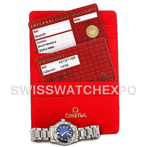 The image shows the Omega 2224.80.00 Women
s Stainless Steel Blue Dial 2224.80.00 Women
s Stainless Steel Blue Dial Seamaster Steel Ladies Watch 2285.80.00 along with its warranty cards and a red cardholder.
