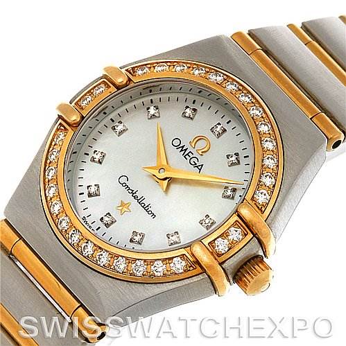 The image shows the face and partial bracelet of the Omega 1365.75.00 Women
s Steel and Gold (two tone) Mother of Pearl Dial 1365.75.00 Women
s Steel and Gold (two tone) Mother of Pearl Dial Ladies Constellation Diamond Mini 1365.75.00 watch from a tilted top-down angle.