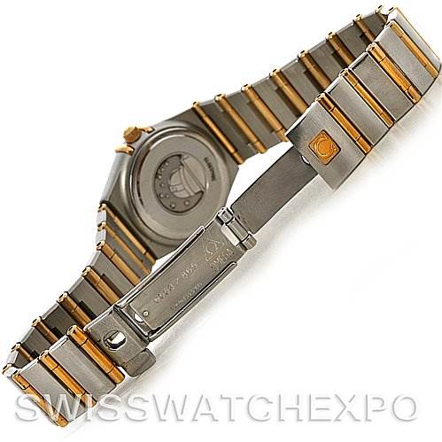 The image shows the back and clasp of the Omega 1365.75.00 Women
s Steel and Gold (two tone) Mother of Pearl Dial 1365.75.00 Women
s Steel and Gold (two tone) Mother of Pearl Dial Ladies Constellation Diamond Mini 1365.75.00 watch at an angled view.