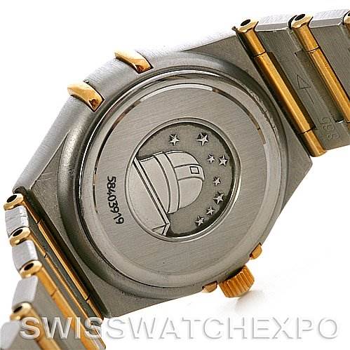 The image shows the case back and part of the bracelet of the Omega 1365.75.00 Women
s Steel and Gold (two tone) Mother of Pearl Dial 1365.75.00 Women
s Steel and Gold (two tone) Mother of Pearl Dial Constellation Diamond Mini 1365.75.00 watch.