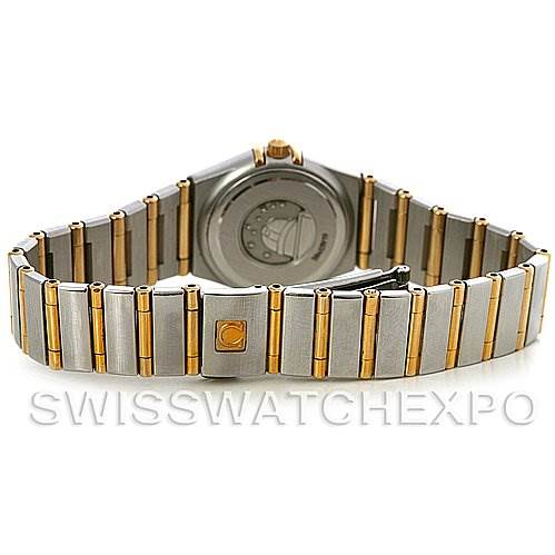 The image shows the back view of the Omega 1365.75.00 Women
s Steel and Gold (two tone) Mother of Pearl Dial 1365.75.00 Women
s Steel and Gold (two tone) Mother of Pearl Dial Ladies Constellation Diamond Mini 1365.75.00, focusing on the clasp and bracelet.