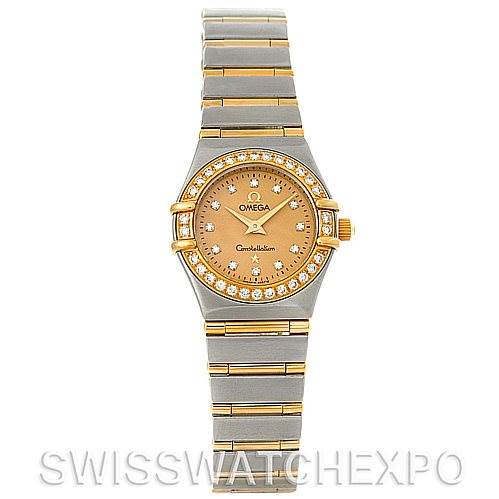 The image shows a frontal view of the Omega 1267.15.00 Women
s Steel and Gold (two tone) Champagne Dial 1267.15.00 Women
s Steel and Gold (two tone) Champagne Dial Constellation Mini Steel 18K Yellow Gold Diamond 1267.15.00 Watch, including its dial, bezel, and bracelet.