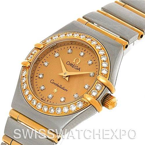 This angled image shows the face, bezel, crown, and partial bracelet of the Omega 1267.15.00 Women
s Steel and Gold (two tone) Champagne Dial 1267.15.00 Women
s Steel and Gold (two tone) Champagne Dial Constellation Mini Steel 18K Yellow Gold Diamond 1267.15.00.