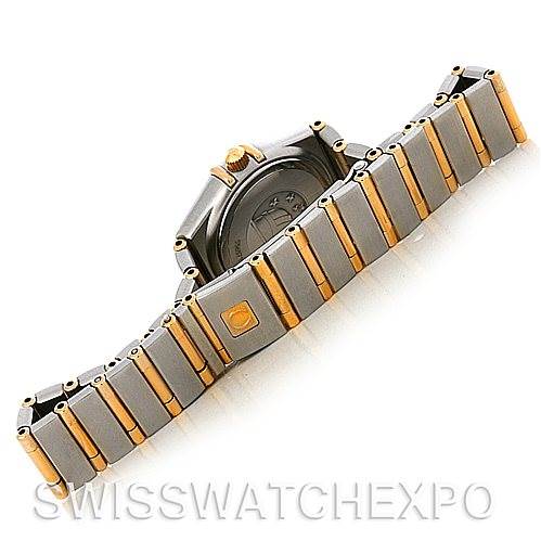 The image shows the back view of the Omega 1267.15.00 Women
s Steel and Gold (two tone) Champagne Dial 1267.15.00 Women
s Steel and Gold (two tone) Champagne Dial Constellation Mini Steel 18K Yellow Gold Diamond 1267.15.00 watch and its bracelet.