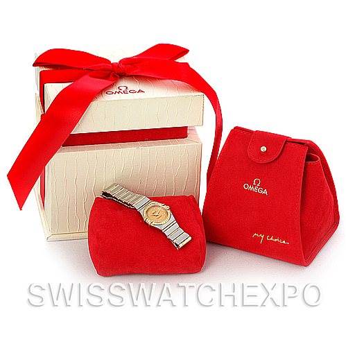 The image shows the Omega 1267.15.00 Women
s Steel and Gold (two tone) Champagne Dial 1267.15.00 Women
s Steel and Gold (two tone) Champagne Dial Constellation Mini Steel 18K Yellow Gold Diamond 1267.15.00 watch in its packaging with accompanying accessories.