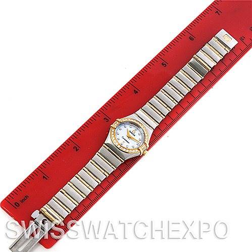 The Omega 1365.75.00 Women
s Steel and Gold (two tone) Mother of Pearl Dial 1365.75.00 Women
s Steel and Gold (two tone) Mother of Pearl Dial Constellation My Choice Steel Gold Diamond Mini 1365.75.00 watch is shown fully extended on a ruler for size reference.