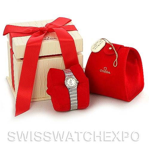 The image shows an Omega 1465.71.00 Women
s Stainless Steel Mother of Pearl Dial 1465.71.00 Women
s Stainless Steel Mother of Pearl Dial Constellation My Choice Ladies Quartz Mini Watch model 1465.71.00 alongside its packaging and a red pouch.