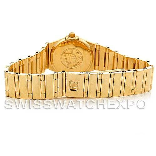 The image shows the backside and bracelet of the Omega 1164.75.00 Women's Yellow Gold Mother of Pearl Dial 1164.75.00 Women's Yellow Gold Mother of Pearl Dial Constellation 18K Yellow Gold Diamond Mini 1164.75.00 watch.