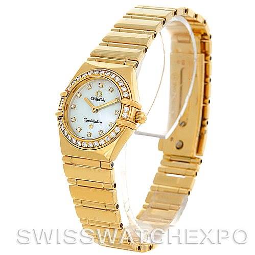 The image shows an angled side view of an Omega 1164.75.00 Women's Yellow Gold Mother of Pearl Dial 1164.75.00 Women's Yellow Gold Mother of Pearl Dial Constellation 18K Yellow Gold Diamond Mini 1164.75.00 watch, highlighting its band and face.