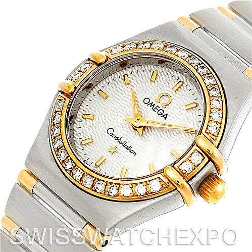The image shows a close-up of the dial, bezel, and part of the bracelet of the Omega Women's Steel and Gold (two tone) White Dial Women's Steel and Gold (two tone) White Dial Constellation Mini Steel and Gold Diamond Watch model.