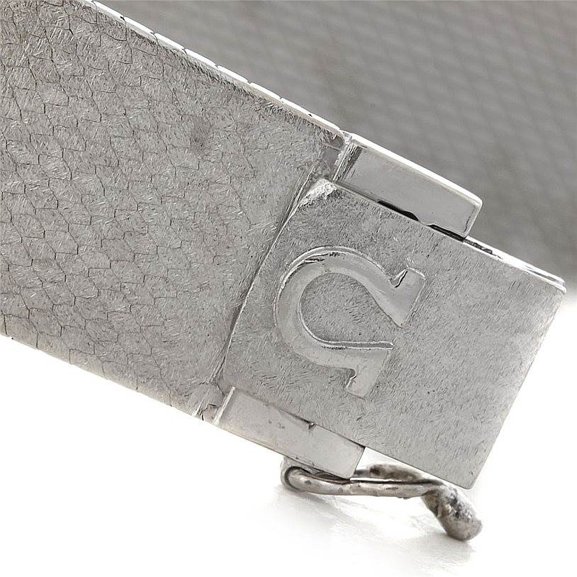 The image shows a close-up of the clasp of an Omega Women's White Gold Silver Dial Women's White Gold Silver Dial Deville Vintage Ladies 18k White Gold Diamond Watch.