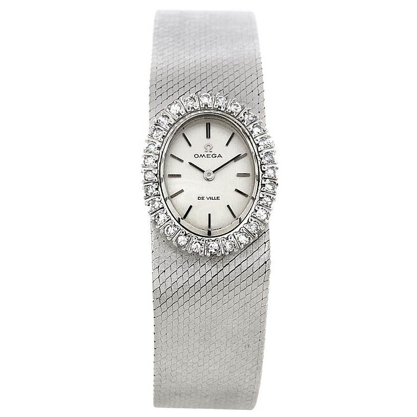 The image shows the front view of an Omega Women's White Gold Silver Dial Women's White Gold Silver Dial Deville Vintage Ladies 18k White Gold Diamond Watch, highlighting the dial and diamond bezel.
