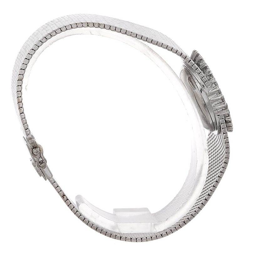 The image shows a side view of the Omega Women's White Gold Silver Dial Women's White Gold Silver Dial Deville Vintage Ladies 18k White Gold Diamond Watch, highlighting the band and clasp.