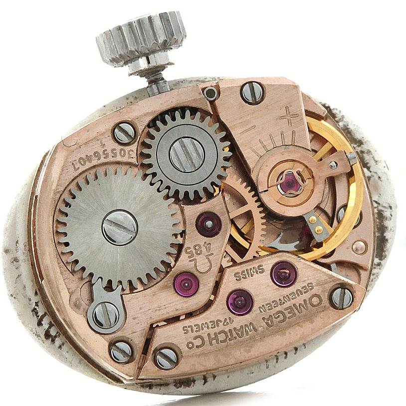 The image displays the inner mechanical movement parts of the Omega Women's White Gold Silver Dial Women's White Gold Silver Dial Deville Vintage Ladies 18k White Gold Diamond Watch.