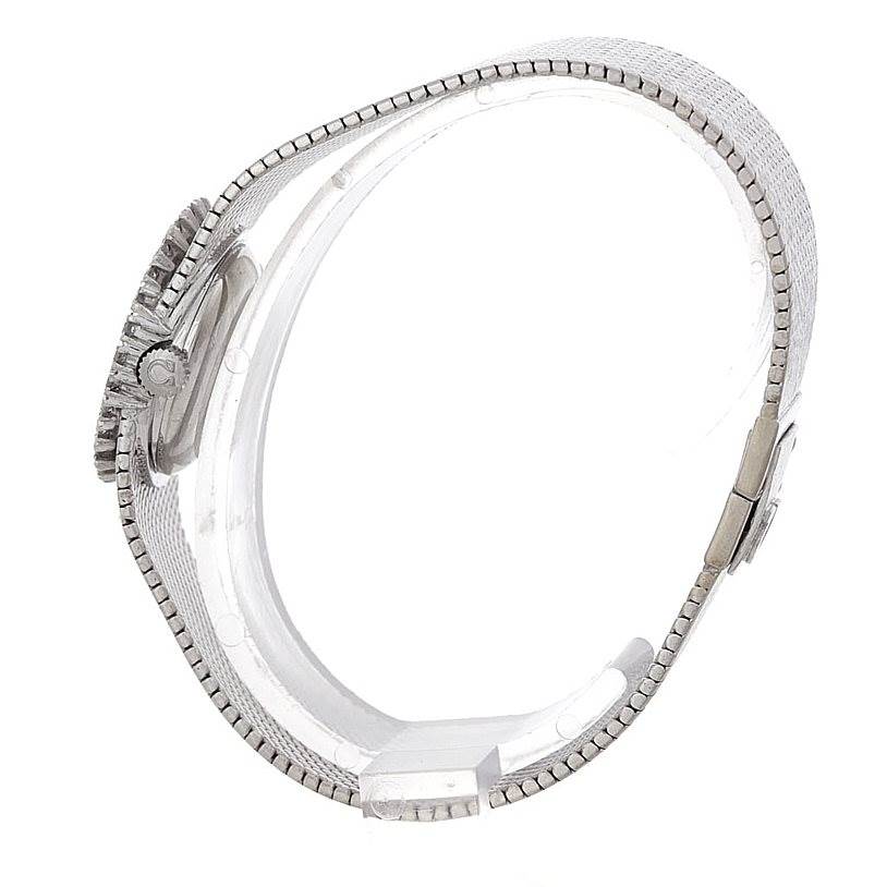 The image shows a side view of the Omega Women's White Gold Silver Dial Women's White Gold Silver Dial Deville Vintage Ladies 18k White Gold Diamond Watch, highlighting the band and side of the case.