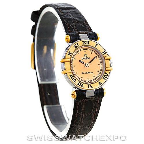 The image shows an angled view of an Omega Women
s Steel and Gold (two tone) Champagne Dial Women
s Steel and Gold (two tone) Champagne Dial Constellation Steel and Gold Ladies Watch, highlighting the face, bezel, and leather strap.