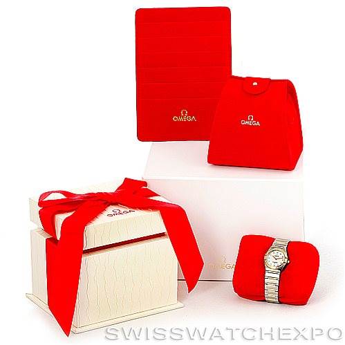 The image shows a Constellation My Choice Steel and Gold Diamond Watch 1376.75.00 by Omega 1376.75.00 Women
s Steel and Gold (two tone) Mother of Pearl Dial 1376.75.00 Women
s Steel and Gold (two tone) Mother of Pearl Dial along with its red packaging and accessories.