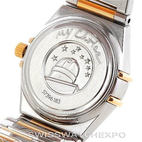 This is a rear view of the Ladies Constellation Diamond Mini 1365.75.00 watch by Omega 1365.75.00 Women
s Steel and Gold (two tone) Mother of Pearl Dial 1365.75.00 Women
s Steel and Gold (two tone) Mother of Pearl Dial, showing the engraved case back and part of the bracelet.
