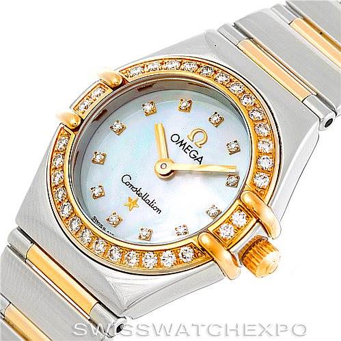 The image shows a close-up view of the Omega 1365.75.00 Women
s Steel and Gold (two tone) Mother of Pearl Dial 1365.75.00 Women
s Steel and Gold (two tone) Mother of Pearl Dial Ladies Constellation Diamond Mini 1365.75.00 model, highlighting the diamond-encrusted bezel, mother-of-pearl dial, and two-tone bracelet.