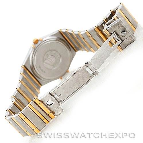 The image shows the back view of the Omega 123.25.24.60.55.003 Women
s Steel and Gold (two tone) Mother of Pearl Dial 123.25.24.60.55.003 Women
s Steel and Gold (two tone) Mother of Pearl Dial Constellation My Choice Steel Gold Diamond Watch 123.25.24.60.55.003, highlighting its clasp and bracelet.