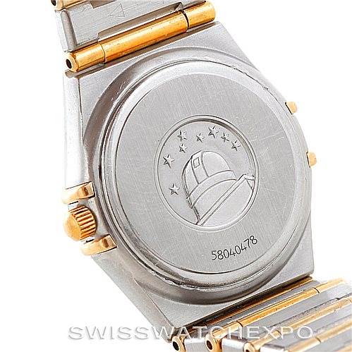 The image shows the back casing and part of the bracelet of the Omega 123.25.24.60.55.003 Women
s Steel and Gold (two tone) Mother of Pearl Dial 123.25.24.60.55.003 Women
s Steel and Gold (two tone) Mother of Pearl Dial Constellation My Choice Steel Gold Diamond Watch 123.25.24.60.55.003.