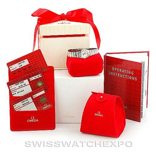 The image shows the Omega 1365.71.00 Women
s Steel and Gold (two tone) Mother of Pearl Dial 1365.71.00 Women
s Steel and Gold (two tone) Mother of Pearl Dial Constellation Diamond Mini 1365.71.00 watch, its box, operating instructions, and warranty cards from a front angle.