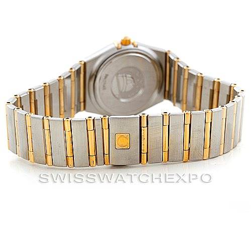 The image shows the bracelet and case back of an Omega 1277.70.00 Women
s Steel and Gold (two tone) Mother of Pearl Dial 1277.70.00 Women
s Steel and Gold (two tone) Mother of Pearl Dial Constellation My Choice Steel Gold Diamond Watch model 1277.70.00 at an angle.