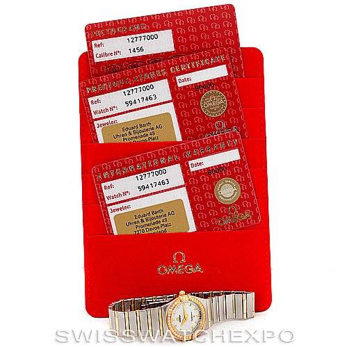 The image shows an Omega 1277.70.00 Women
s Steel and Gold (two tone) Mother of Pearl Dial 1277.70.00 Women
s Steel and Gold (two tone) Mother of Pearl Dial Constellation My Choice Steel Gold Diamond Watch 1277.70.00 and its accompanying red Best Quality
ity cards.