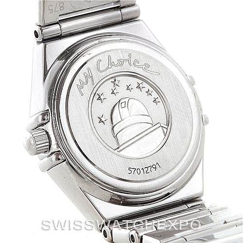 The image shows the back case of the Omega 1465.71.00 Women
s Stainless Steel Mother of Pearl Dial 1465.71.00 Women
s Stainless Steel Mother of Pearl Dial Constellation My Choice Ladies Mini Watch 1465.71.00, featuring engravings and part of the bracelet.