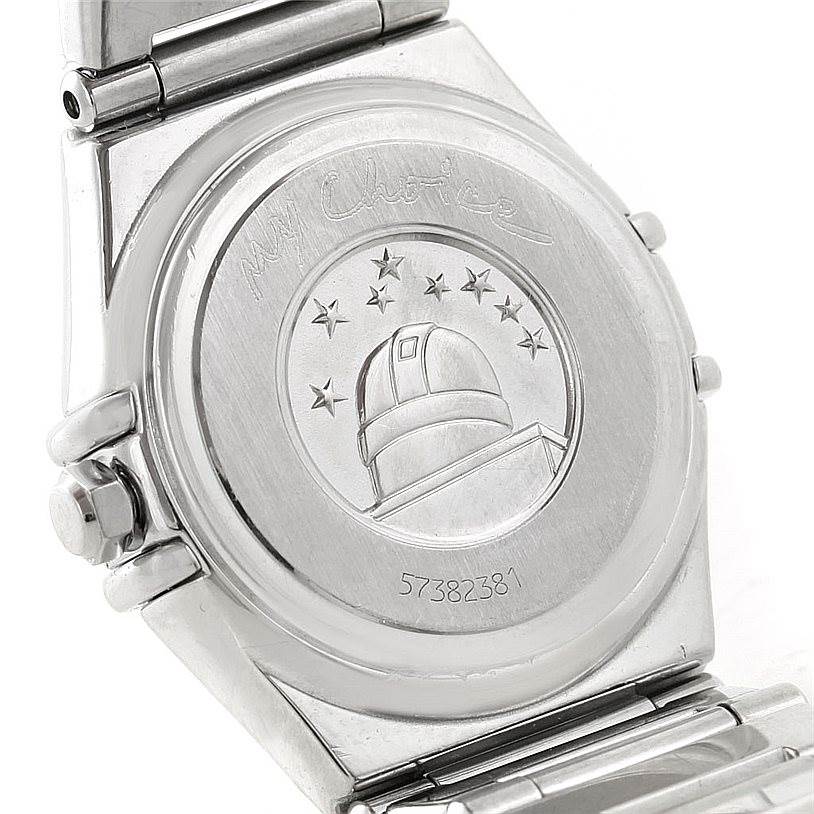 The image shows the back case of the Omega 1465.71.00 Women
s Stainless Steel Mother of Pearl Dial 1465.71.00 Women
s Stainless Steel Mother of Pearl Dial Constellation My Choice Ladies Mini Diamond Watch 1465.71.00 with engravings.