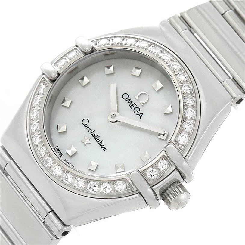 The image shows an angled close-up of the face, bezel, and part of the bracelet of the Omega 1465.71.00 Women
s Stainless Steel Mother of Pearl Dial 1465.71.00 Women
s Stainless Steel Mother of Pearl Dial Constellation My Choice Ladies Diamond Mini Watch 1465.71.00.