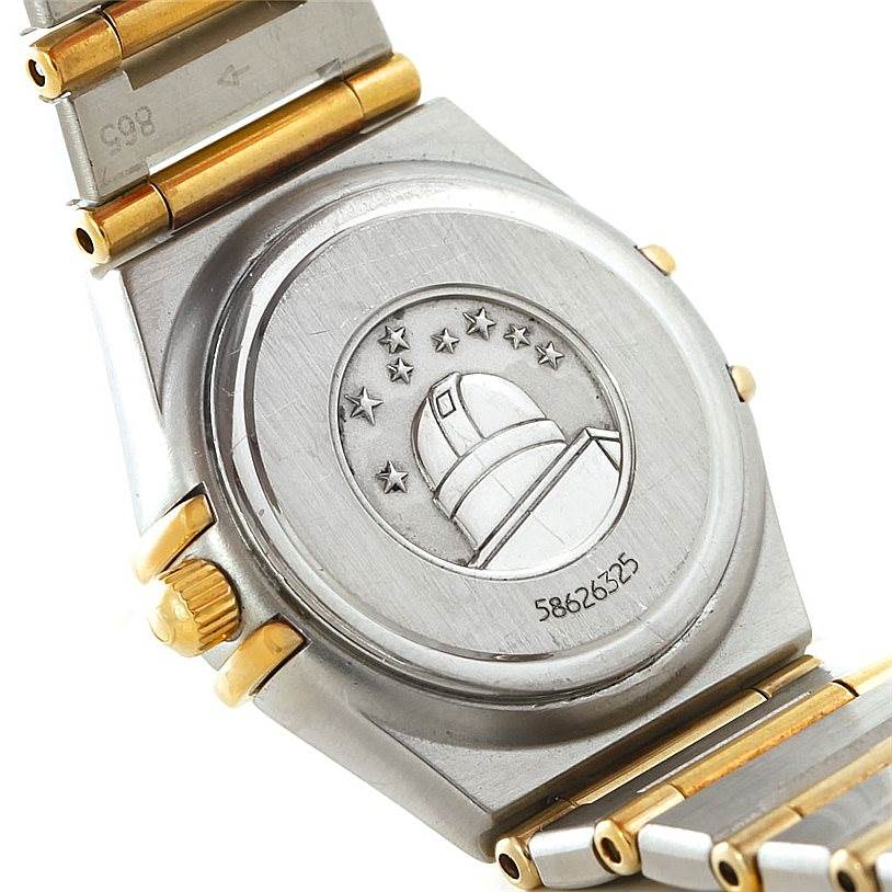 The image shows the back case and partial bracelet of the Omega 1267.70.00 Women
s Steel and Gold (two tone) Mother of Pearl Dial 1267.70.00 Women
s Steel and Gold (two tone) Mother of Pearl Dial Constellation Ladies Diamond Mini Watch 1267.70.00.