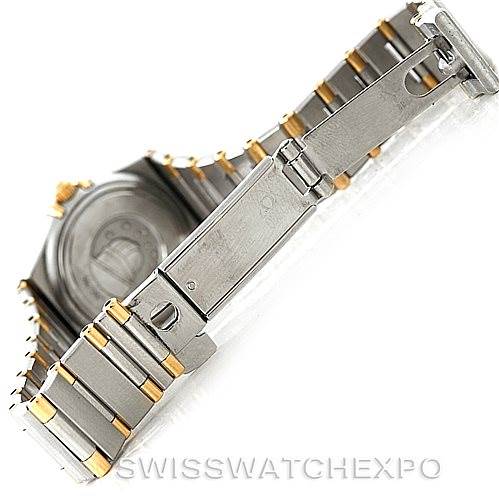 The image shows the open clasp and part of the bracelet of the Omega 1372.70.00 Women
s Steel and Gold (two tone) Mother of Pearl Dial 1372.70.00 Women
s Steel and Gold (two tone) Mother of Pearl Dial Constellation Steel and Gold Ladies Watch 1372.70.00 model.