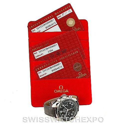 The image shows an Omega 324.33.38.40.06.001 Women's Stainless Steel Grey Dial 324.33.38.40.06.001 Women's Stainless Steel Grey Dial Speedmaster Ladies Watch 324.33.38.40.06.001 alongside its warranty cards and certification documents.