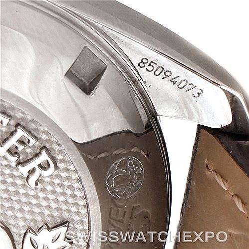 The image shows a close-up of the back and side of an Omega 324.33.38.40.06.001 Women's Stainless Steel Grey Dial 324.33.38.40.06.001 Women's Stainless Steel Grey Dial Speedmaster Ladies Watch 324.33.38.40.06.001, highlighting the serial number.