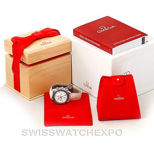 The image shows the Omega 3834.70.36 Women
s Stainless Steel Mother of Pearl Dial 3834.70.36 Women
s Stainless Steel Mother of Pearl Dial Speedmaster Ladies MOP Dial Watch 3834.70.36 model with its wooden presentation box, red pouch, and additional packaging.
