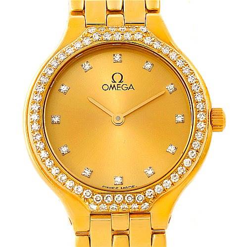 The image shows a frontal view of an Omega Women's Yellow Gold Champagne Dial Women's Yellow Gold Champagne Dial DeVille Ladies 18K Yellow Gold Diamond Watch, featuring the face, bezel, and part of the bracelet.