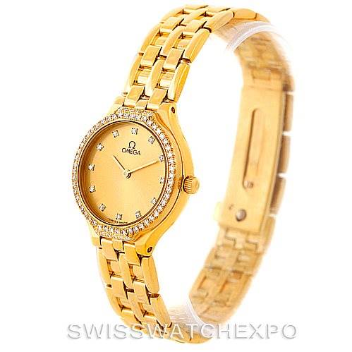 The image shows an angled view of the Omega Women's Yellow Gold Champagne Dial Women's Yellow Gold Champagne Dial DeVille Ladies 18K Yellow Gold Diamond Watch, highlighting the dial and bracelet.