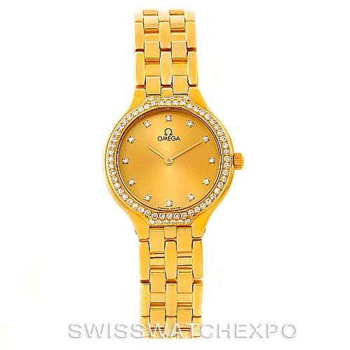 The image shows a front view of the Omega Women's Yellow Gold Champagne Dial Women's Yellow Gold Champagne Dial DeVille Ladies 18K Yellow Gold Diamond Watch, displaying the face, bezel, and bracelet.