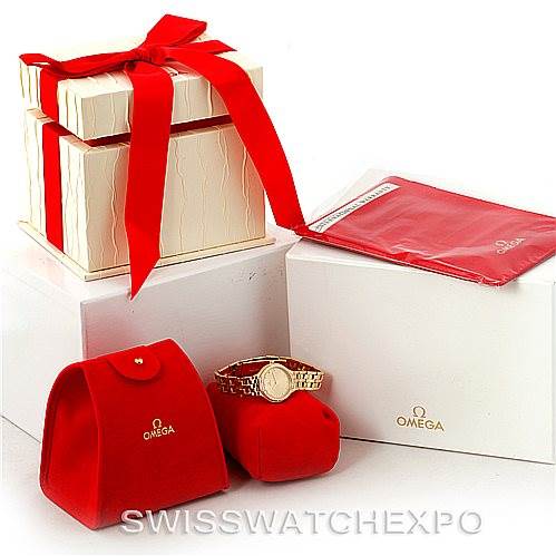 The image shows the Omega Women's Yellow Gold Champagne Dial Women's Yellow Gold Champagne Dial DeVille Ladies 18K Yellow Gold Diamond Watch, a red pouch, a red cloth, and boxed packaging from various angles.