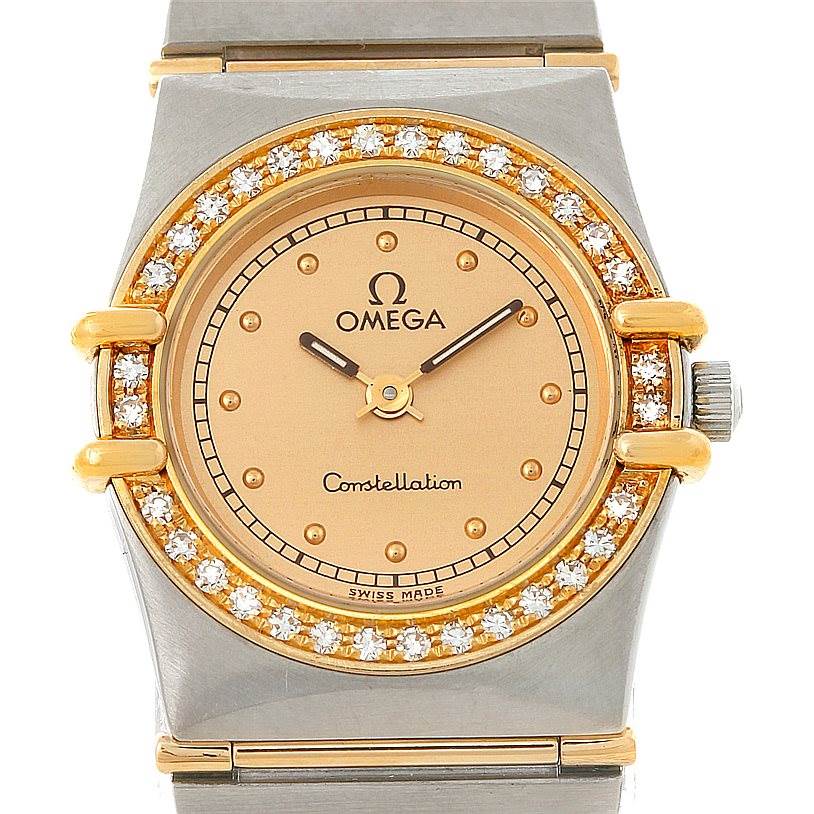 The image shows a frontal view of an Omega Women
s Steel and Gold (two tone) Champagne Dial Women
s Steel and Gold (two tone) Champagne Dial Constellation Mini Steel 18K Yellow Gold Diamond Watch displaying the dial, bezel, and crown.
