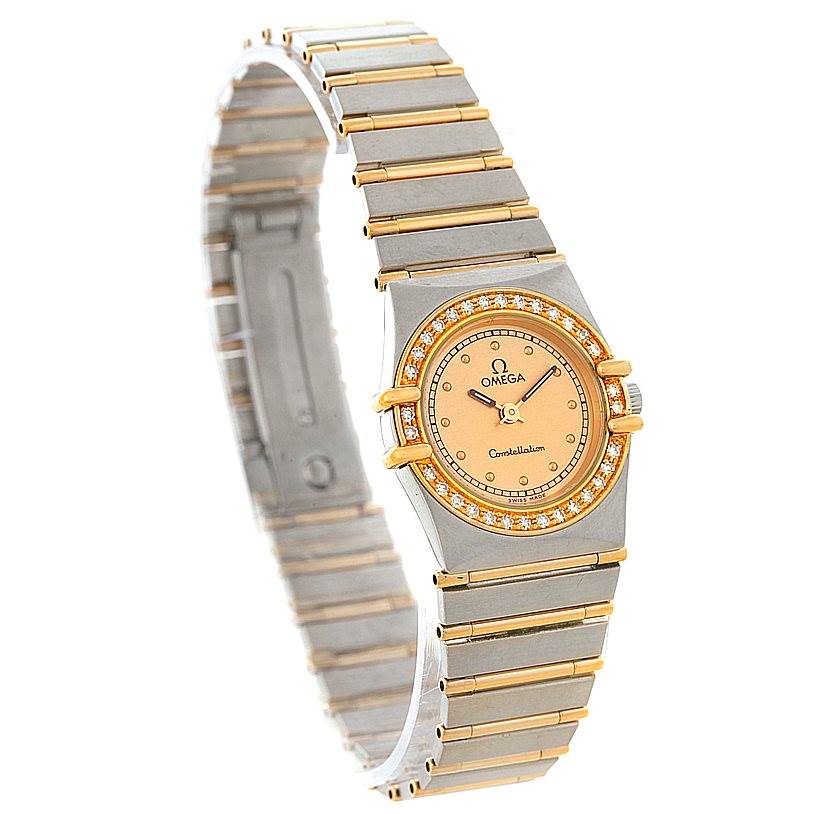 The image shows a front angled view of the Omega Women
s Steel and Gold (two tone) Champagne Dial Women
s Steel and Gold (two tone) Champagne Dial Constellation Mini Steel 18K Yellow Gold Diamond Watch, highlighting its face and band.