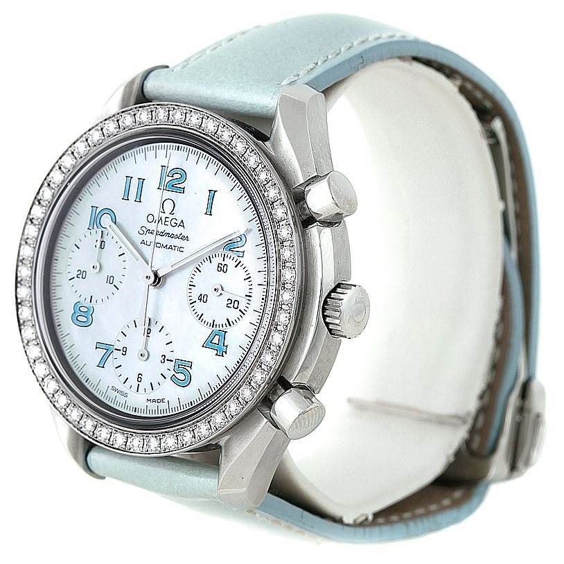 The image showcases an Omega 3815.71.53 Women
s Stainless Steel Mother of Pearl Dial 3815.71.53 Women
s Stainless Steel Mother of Pearl Dial Speedmaster Ladies Diamond MOP Dial Watch model 3815.71.53 at an angled side view, highlighting the bezel, crown, and leather strap.